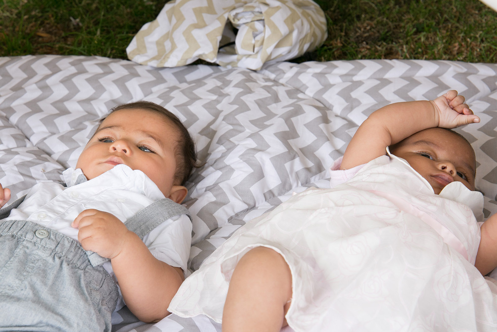 _33A2147 Two babies lying on the grass