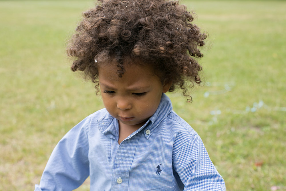 _33A2637 Child playing in the grass
